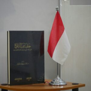 a flag and a book on a table